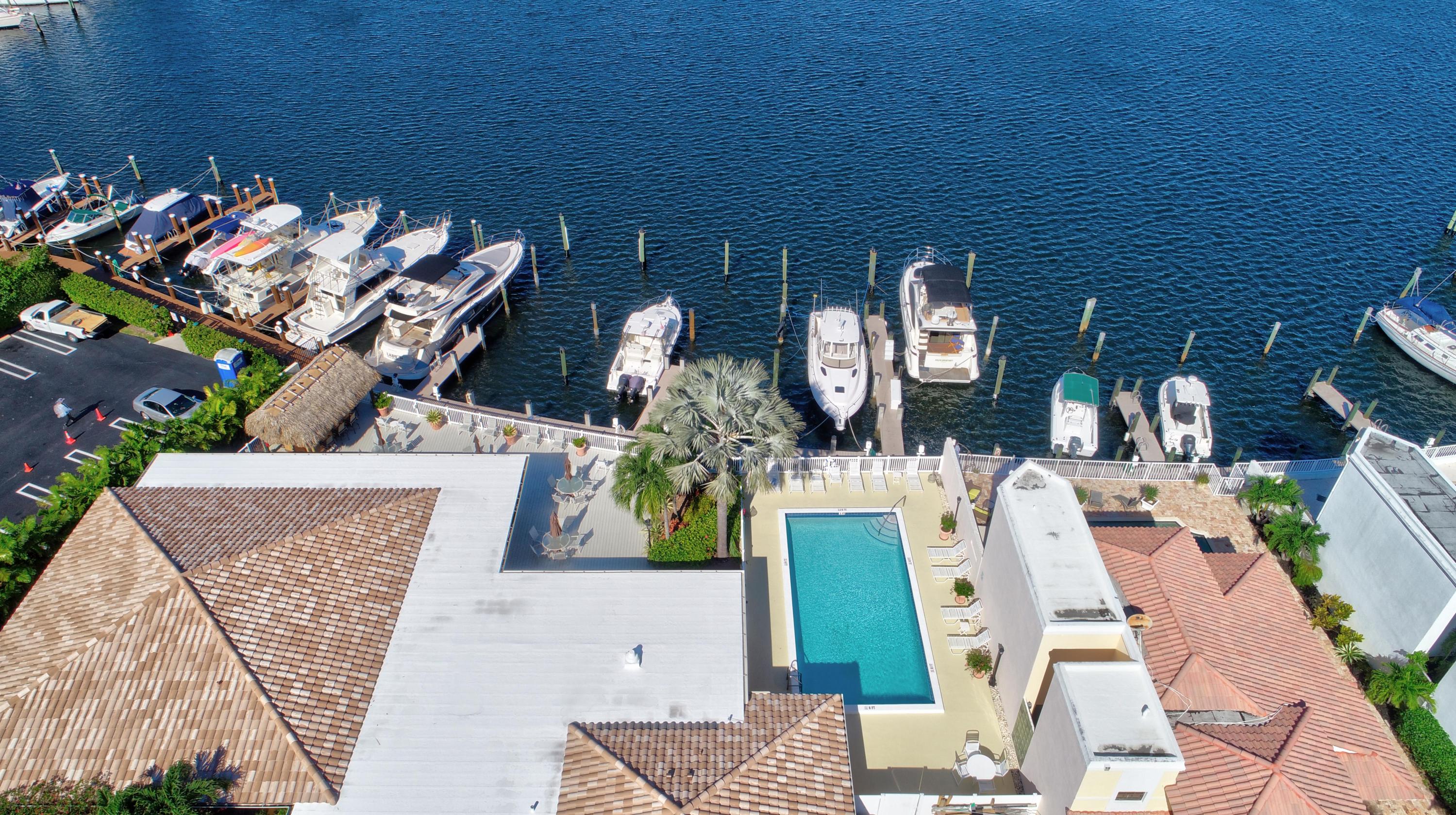 210 Captains Walk, Unit 710 Delray Beach, FL 33483 - Photo 45 of 49 view of living room with furniture and flowers