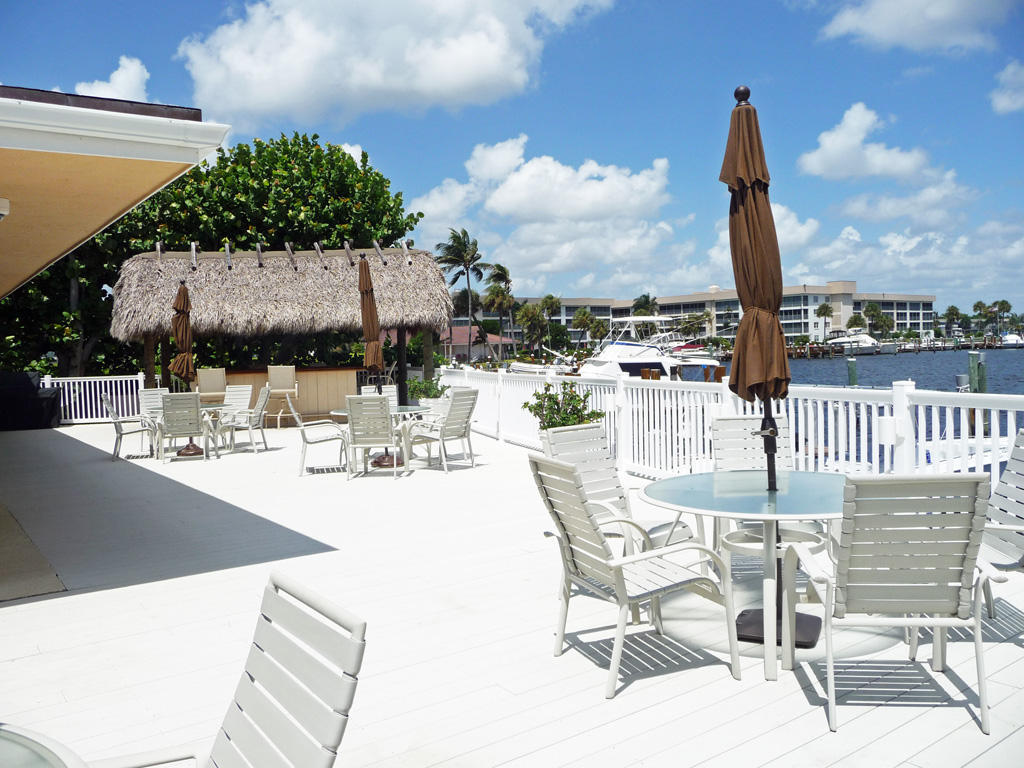 210 Captains Walk, Unit 710 Delray Beach, FL 33483 - Photo 46 of 49 a view of a terrace with furniture and city view
