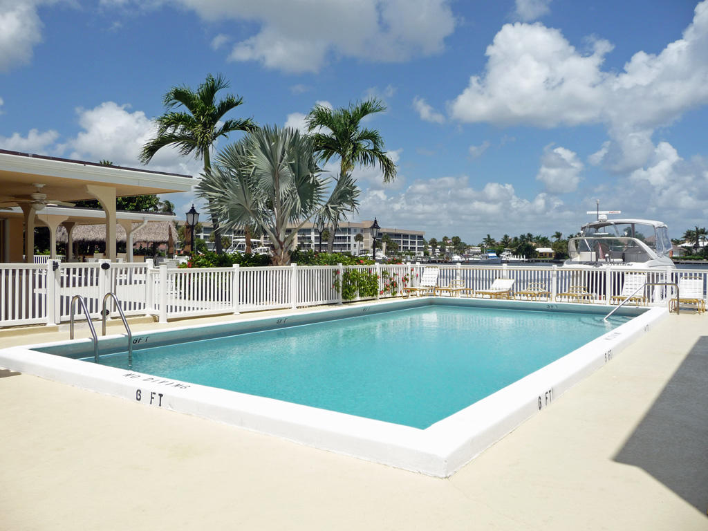 210 Captains Walk, Unit 710 Delray Beach, FL 33483 - Photo 47 of 49 a view of swimming pool with outdoor seating