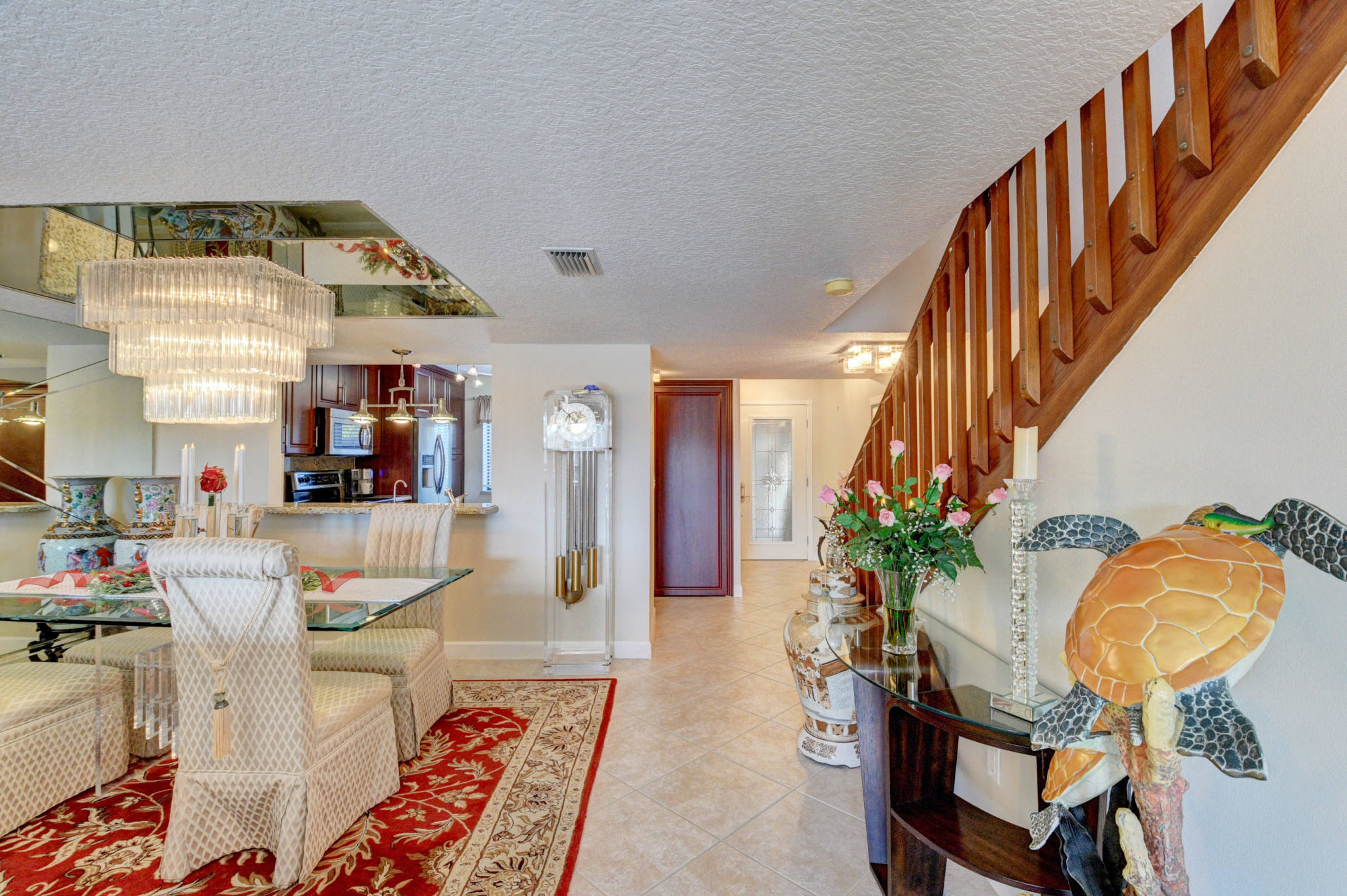 210 Captains Walk, Unit 710 Delray Beach, FL 33483 - Photo 6 of 49 a living room with furniture and a potted plant