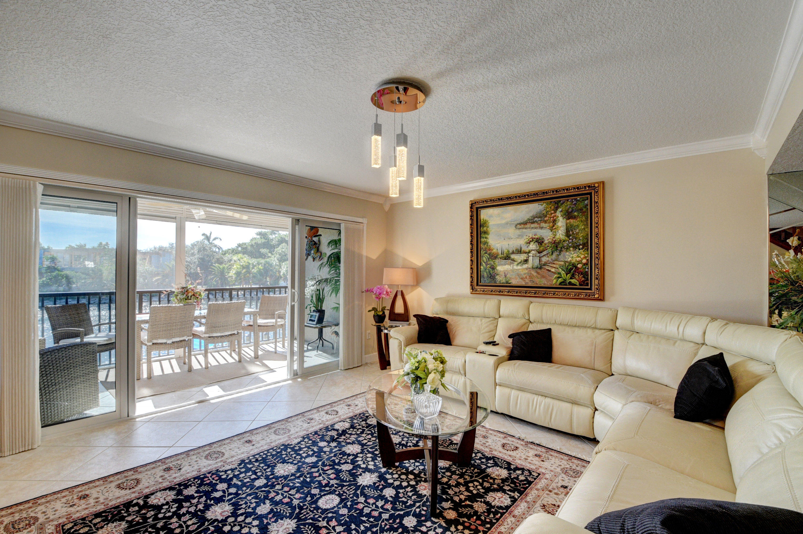 210 Captains Walk, Unit 710 Delray Beach, FL 33483 - Photo 8 of 49 a living room with furniture and a large window