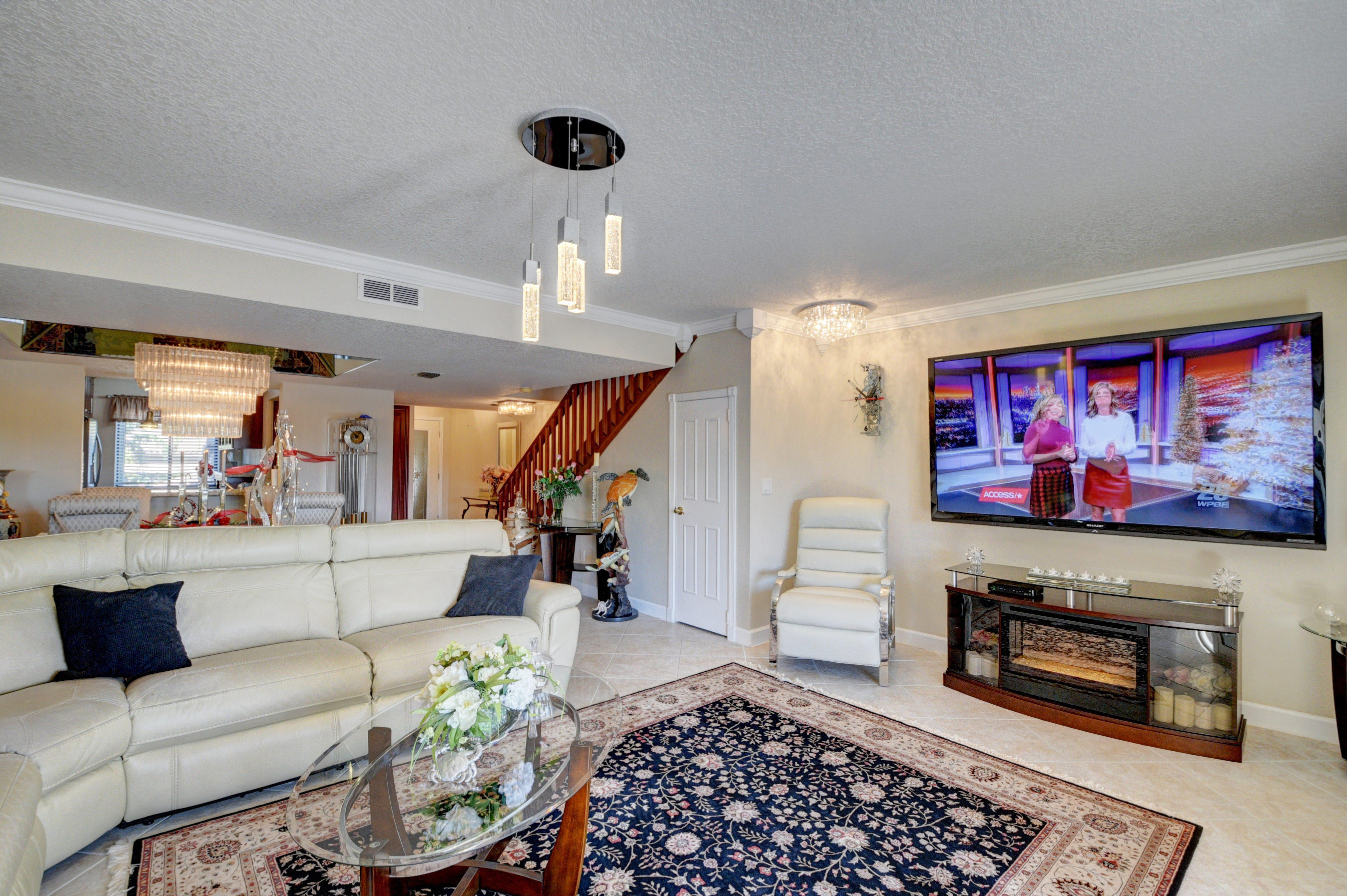 210 Captains Walk, Unit 710 Delray Beach, FL 33483 - Photo 10 of 49 a living room with furniture and a rug