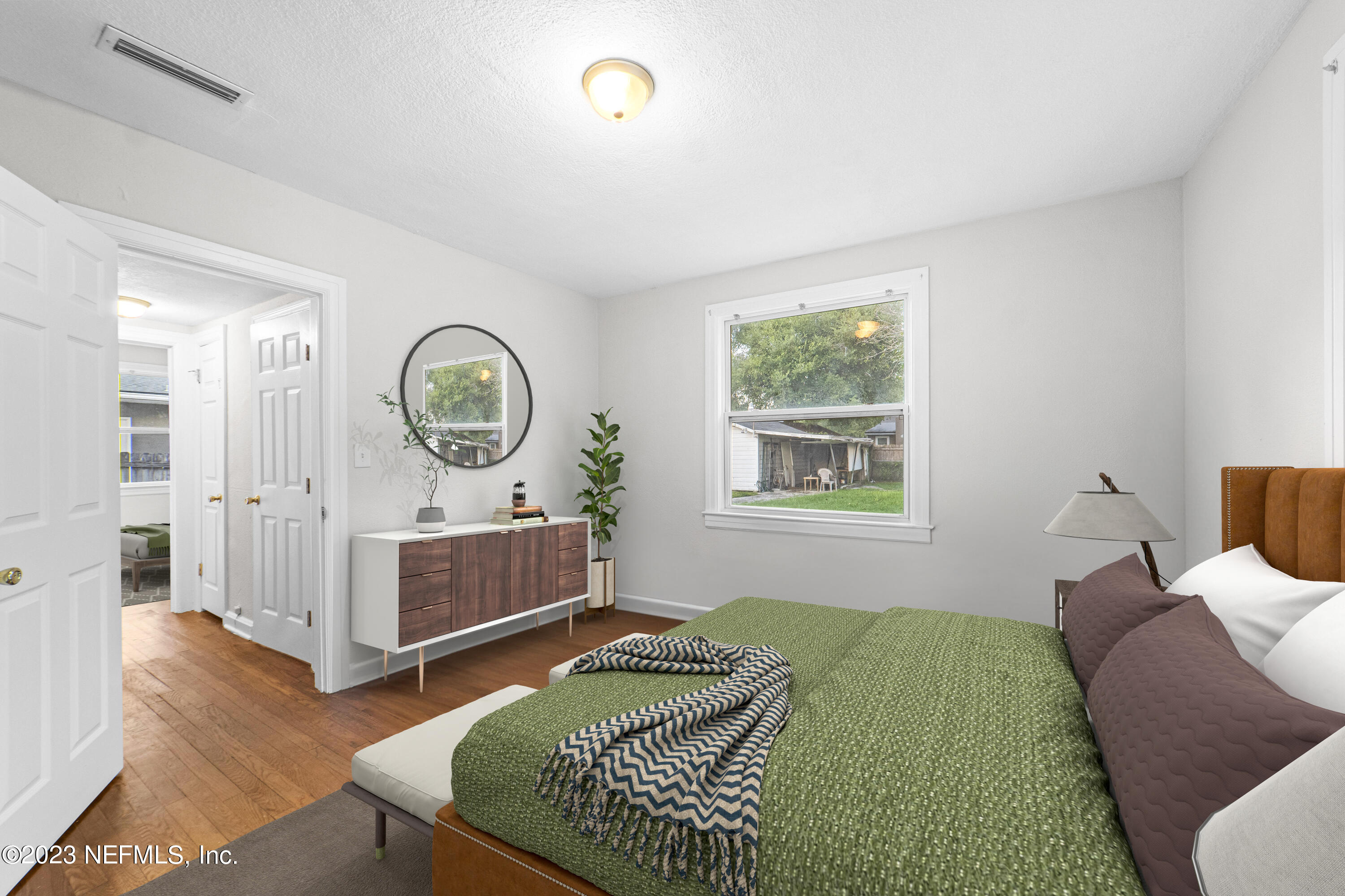 1719 Mayfair Road Jacksonville, FL 32207 - Photo 12 of 14 a bedroom with a bed window and a dresser
