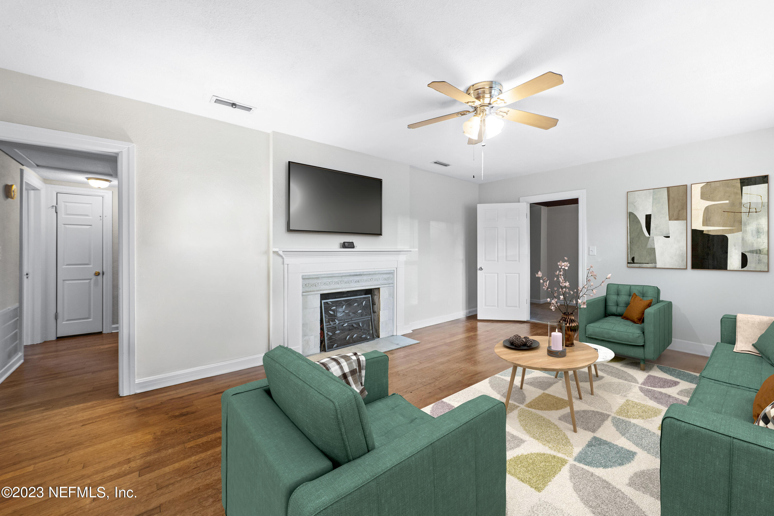 1719 Mayfair Road Jacksonville, FL 32207 - Photo 4 of 14 a living room with furniture a fireplace and a flat screen tv