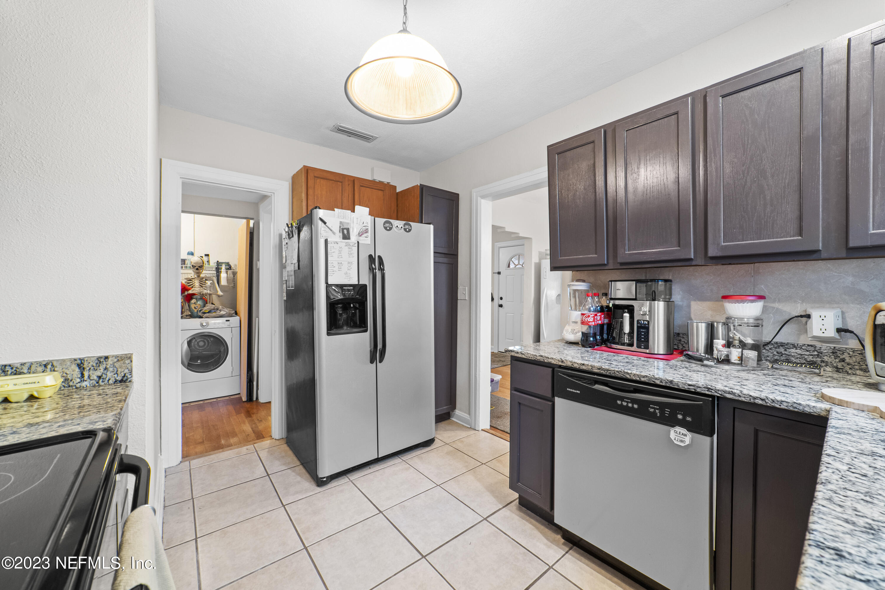 1719 Mayfair Road Jacksonville, FL 32207 - Photo 7 of 14 a kitchen with stainless steel appliances granite countertop a refrigerator and a stove