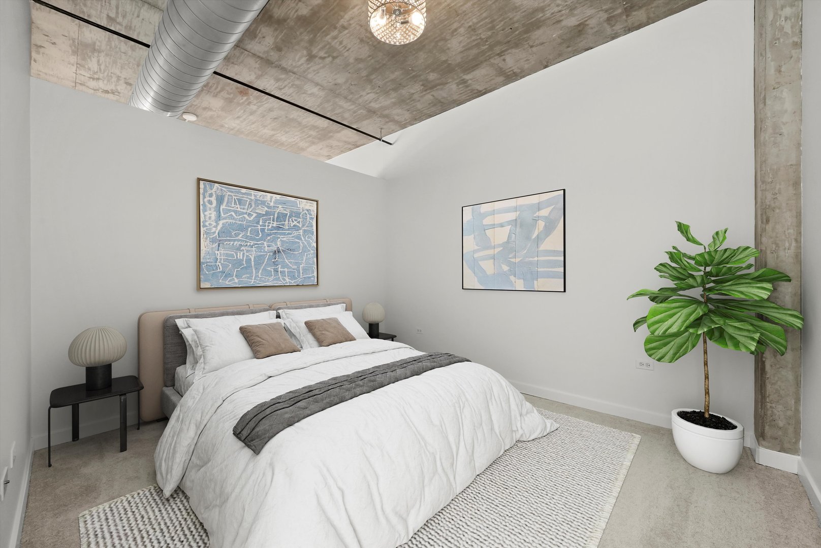 50 East 16th Street, Unit 411 Chicago, IL 60616 - Photo 2 of 2 a bedroom with a bed and a potted plant