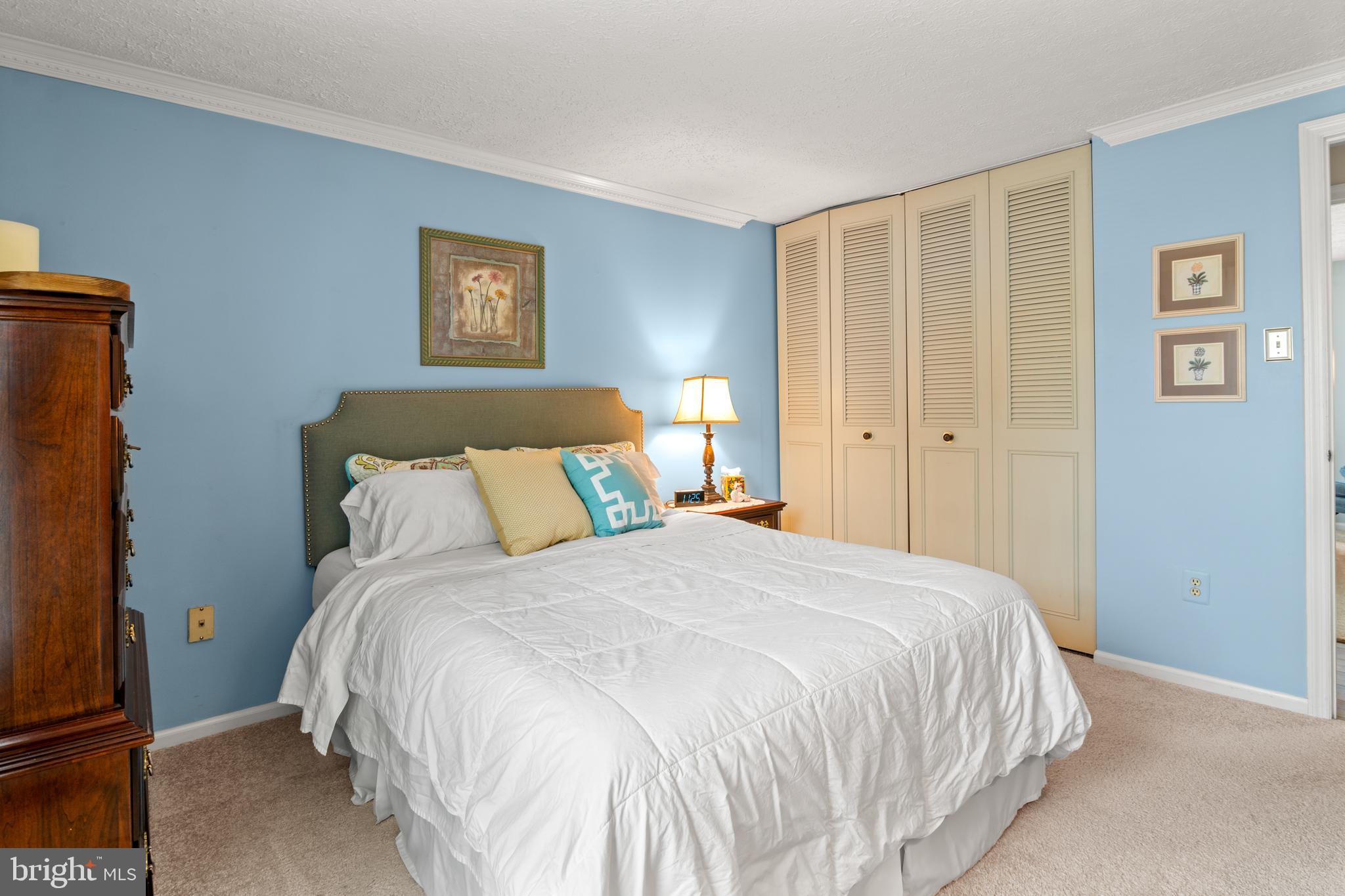 5117 Clifford Road Perry Hall, MD 21128 - Photo 18 of 36 a bedroom with a bed and a night stand
