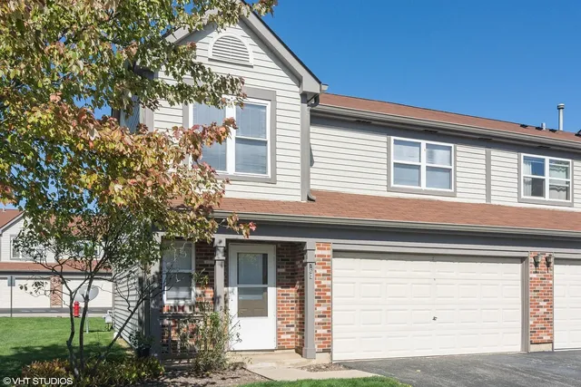 a view of a house with a tree