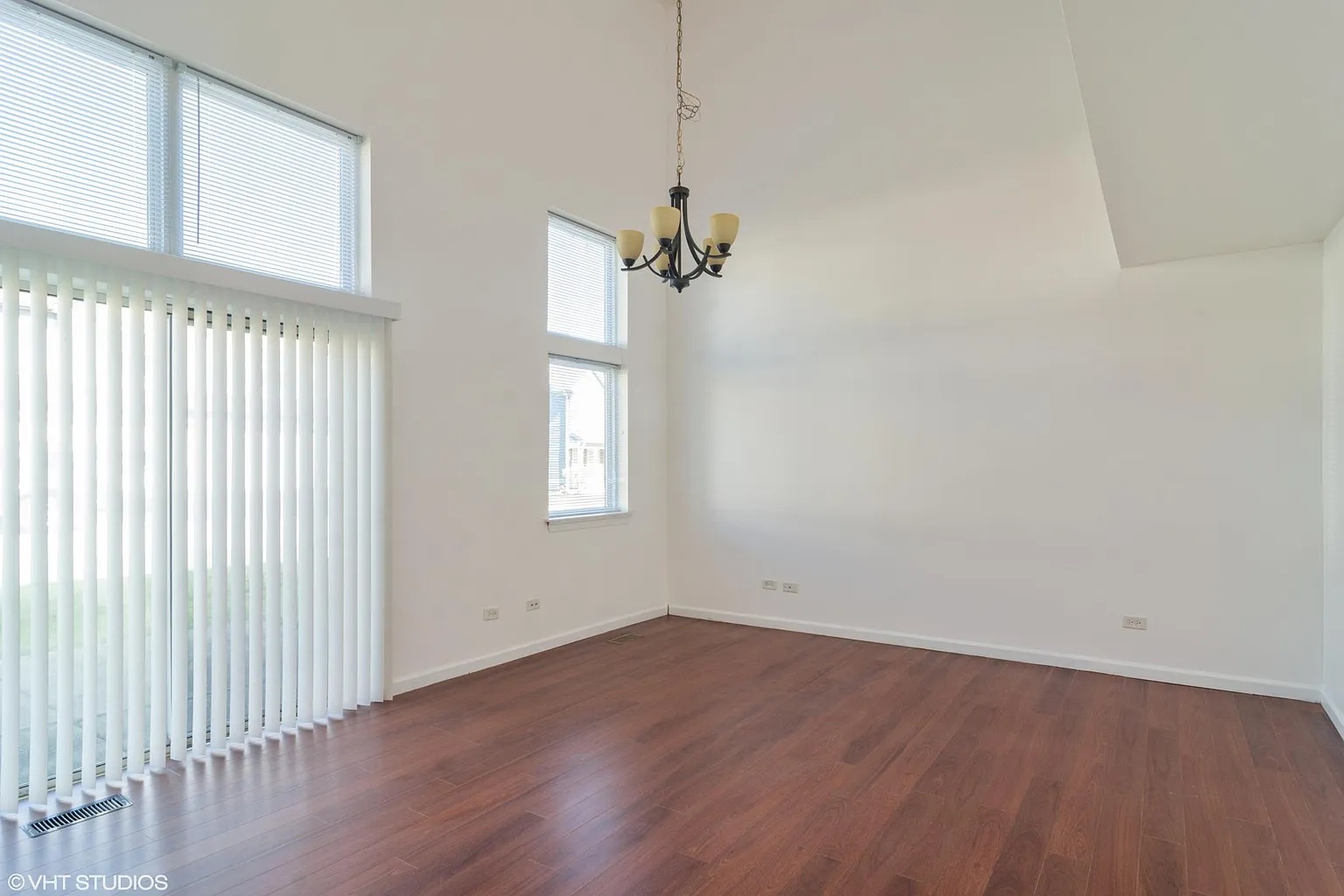 760 East Whispering Oaks Drive, Unit 4A Palatine, IL 60074 - Photo 4 of 10 wooden floor in an empty room with a window