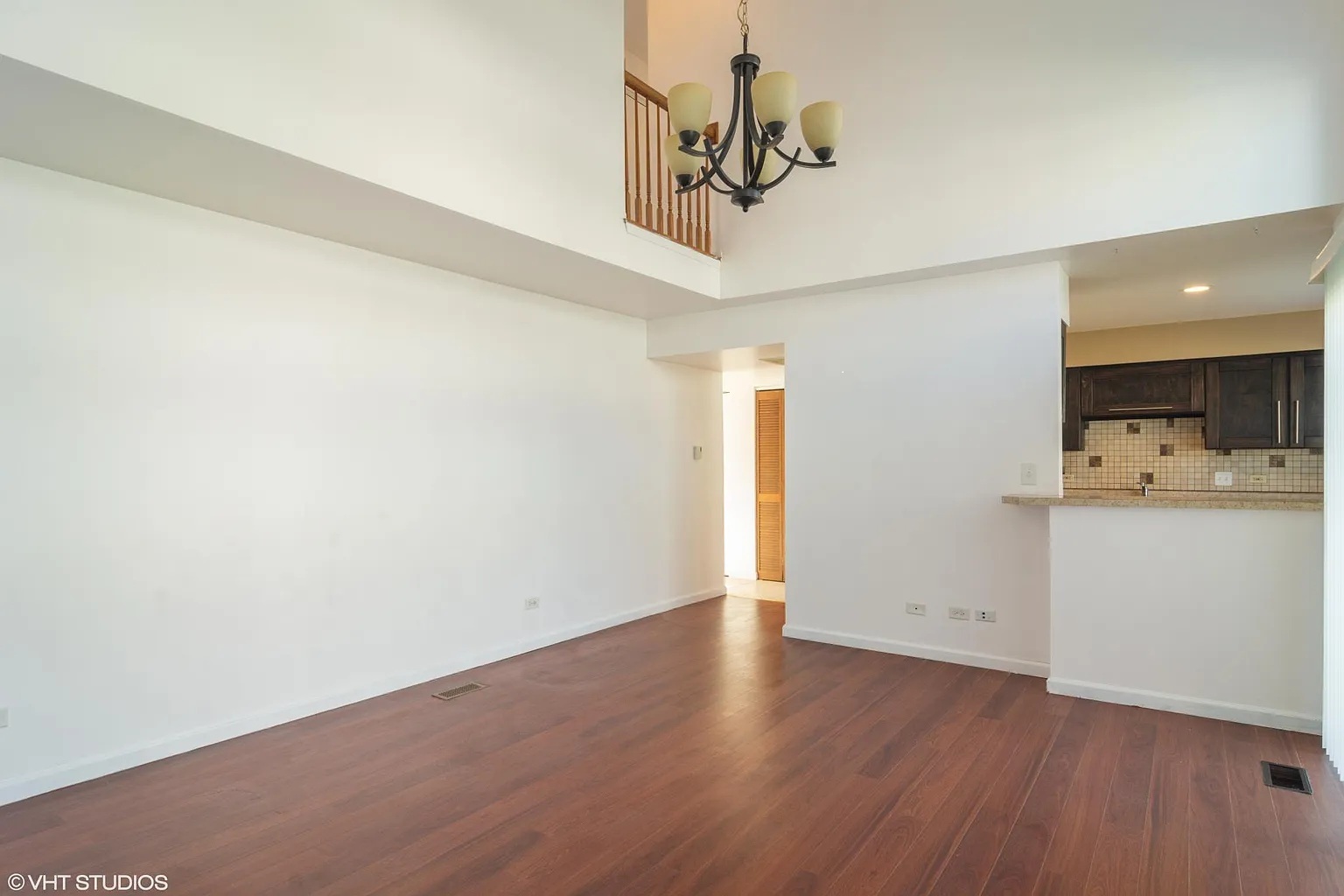 760 East Whispering Oaks Drive, Unit 4A Palatine, IL 60074 - Photo 5 of 10 a view of a room with wooden floor and white walls