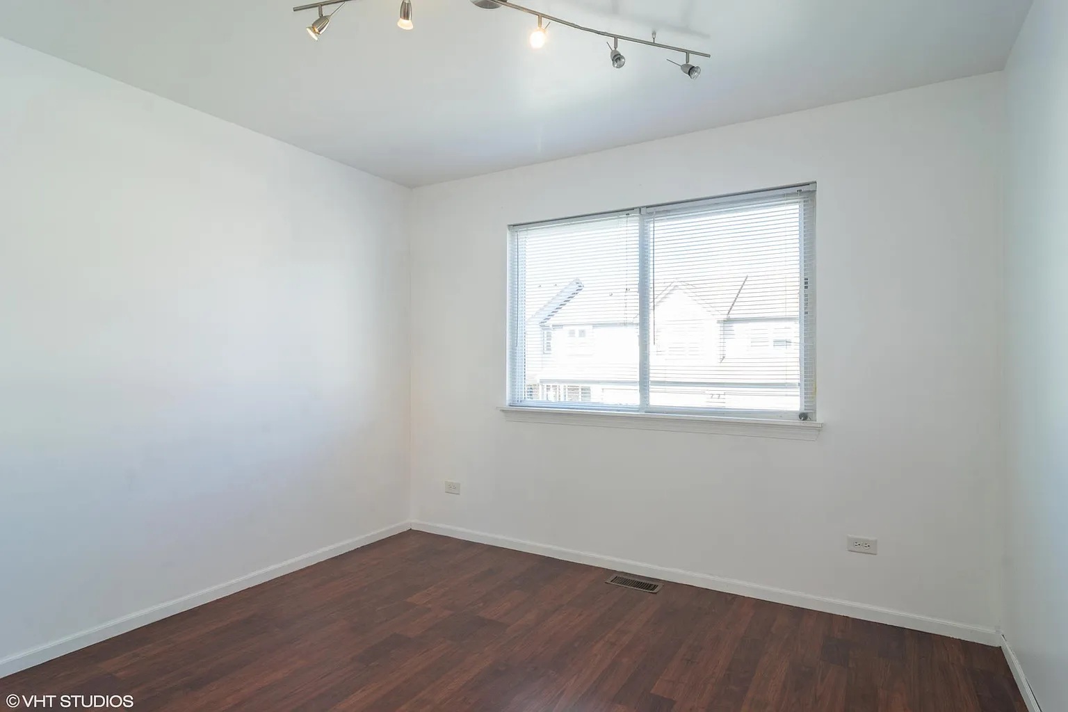 760 East Whispering Oaks Drive, Unit 4A Palatine, IL 60074 - Photo 6 of 10 an empty room with wooden floor and windows