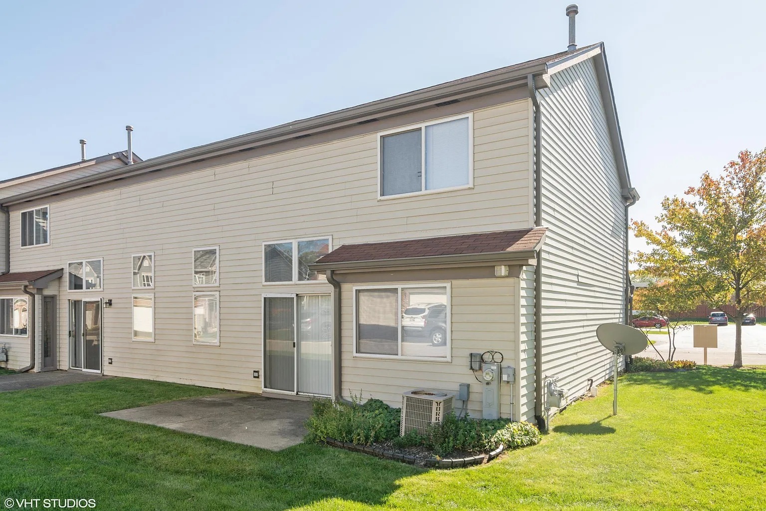 760 East Whispering Oaks Drive, Unit 4A Palatine, IL 60074 - Photo 10 of 10 a front view of a house with yard and glass windows