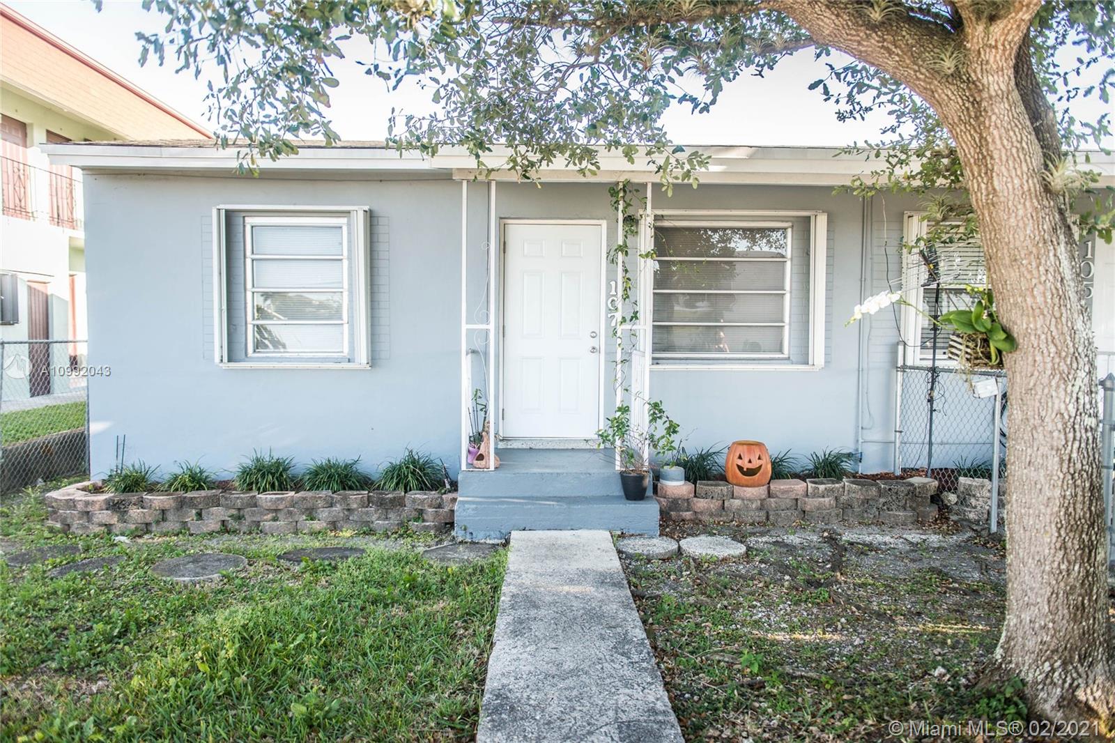 105 Northeast 2nd Road Homestead, FL 33030 - Photo 11 of 26 a front view of a house with a yard