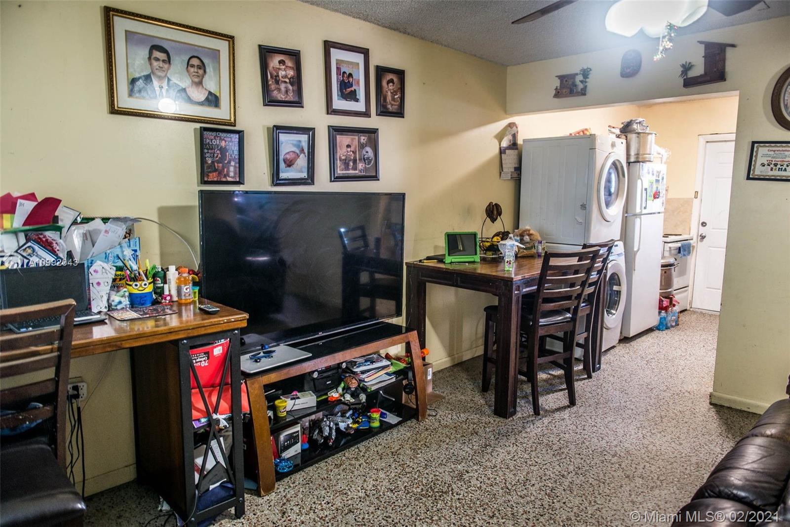 105 Northeast 2nd Road Homestead, FL 33030 - Photo 12 of 26 a room with furniture and a flat screen tv