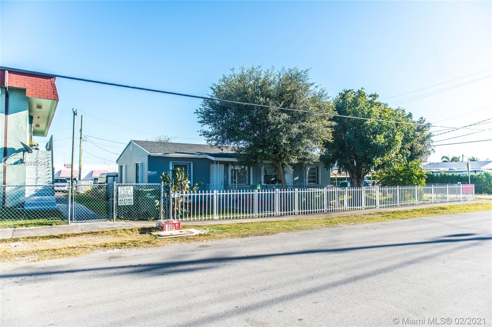 105 Northeast 2nd Road Homestead, FL 33030 - Photo 3 of 26 a view of a house with a swimming pool