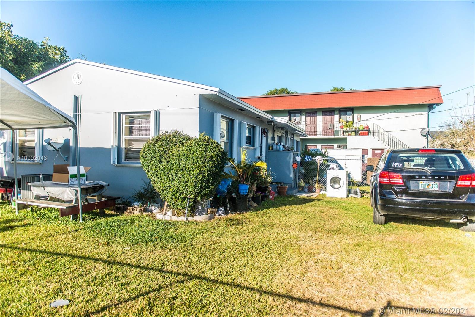 105 Northeast 2nd Road Homestead, FL 33030 - Photo 22 of 26 a view of car parked in front of a building