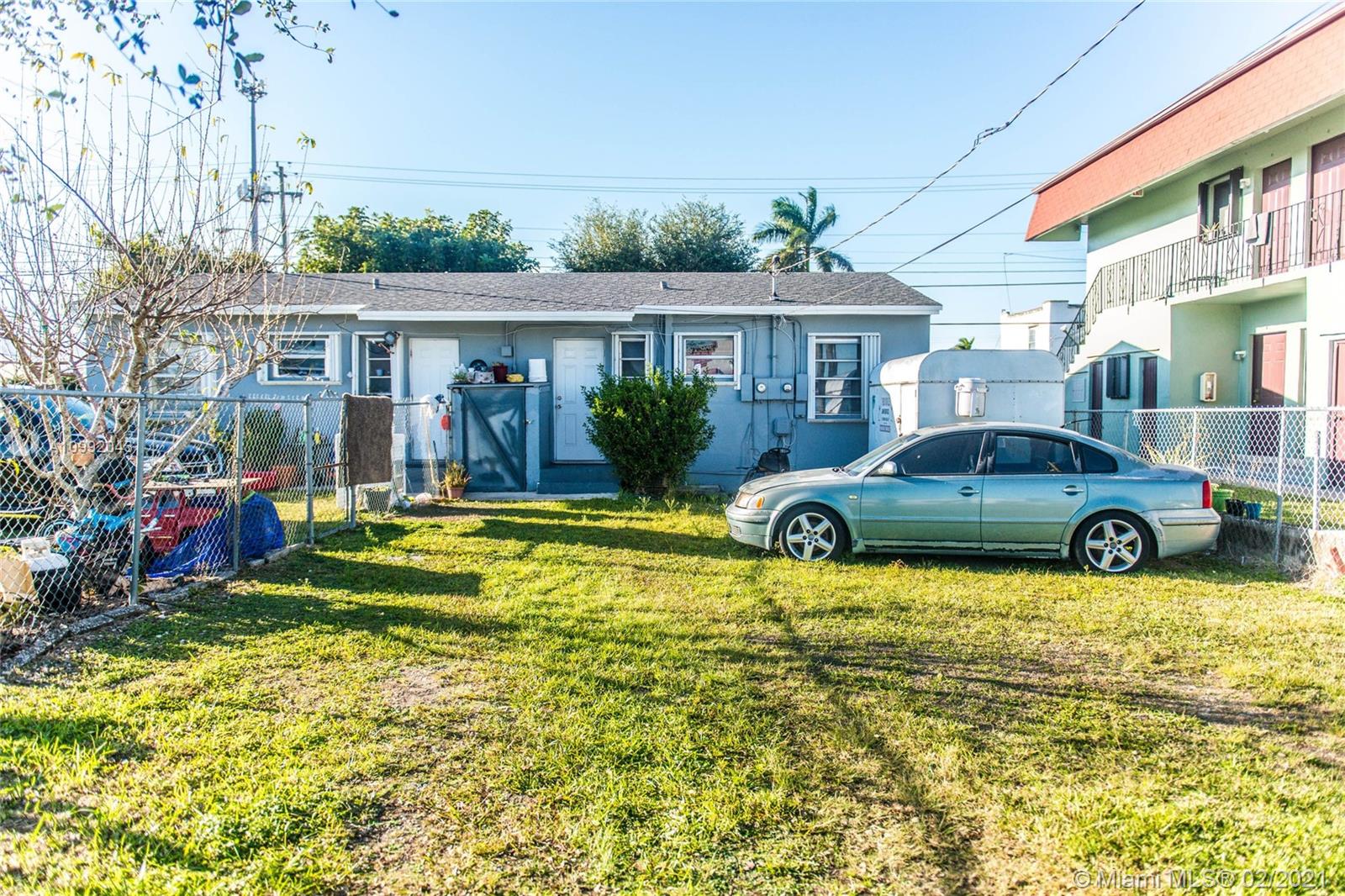 105 Northeast 2nd Road Homestead, FL 33030 - Photo 23 of 26 a view of a house with swimming pool and a yard