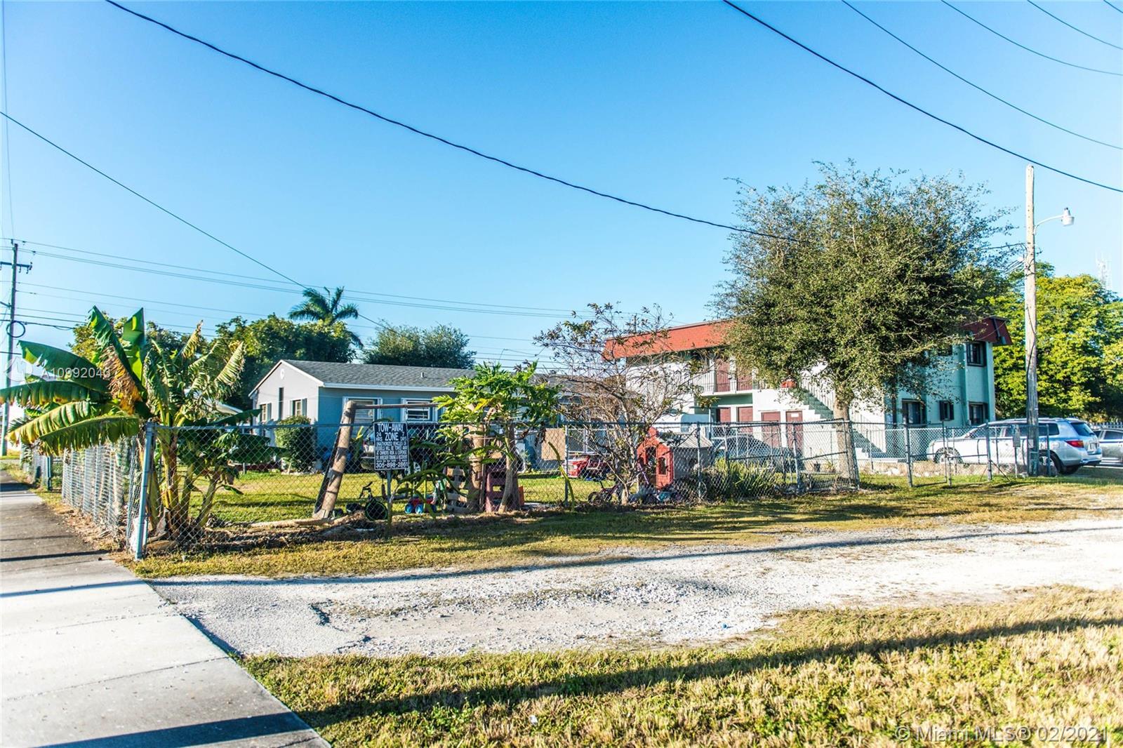105 Northeast 2nd Road Homestead, FL 33030 - Photo 24 of 26 a front view of a building with garden