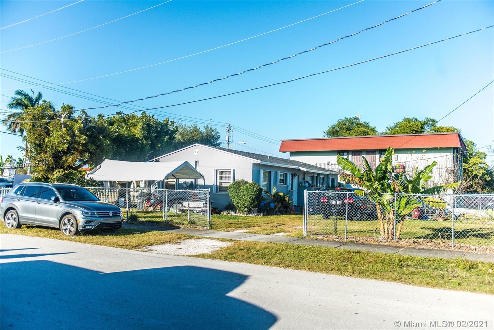 105 Northeast 2nd Road Homestead, FL 33030 - Photo 25 of 26 a view of swimming pool with lawn chairs and plants