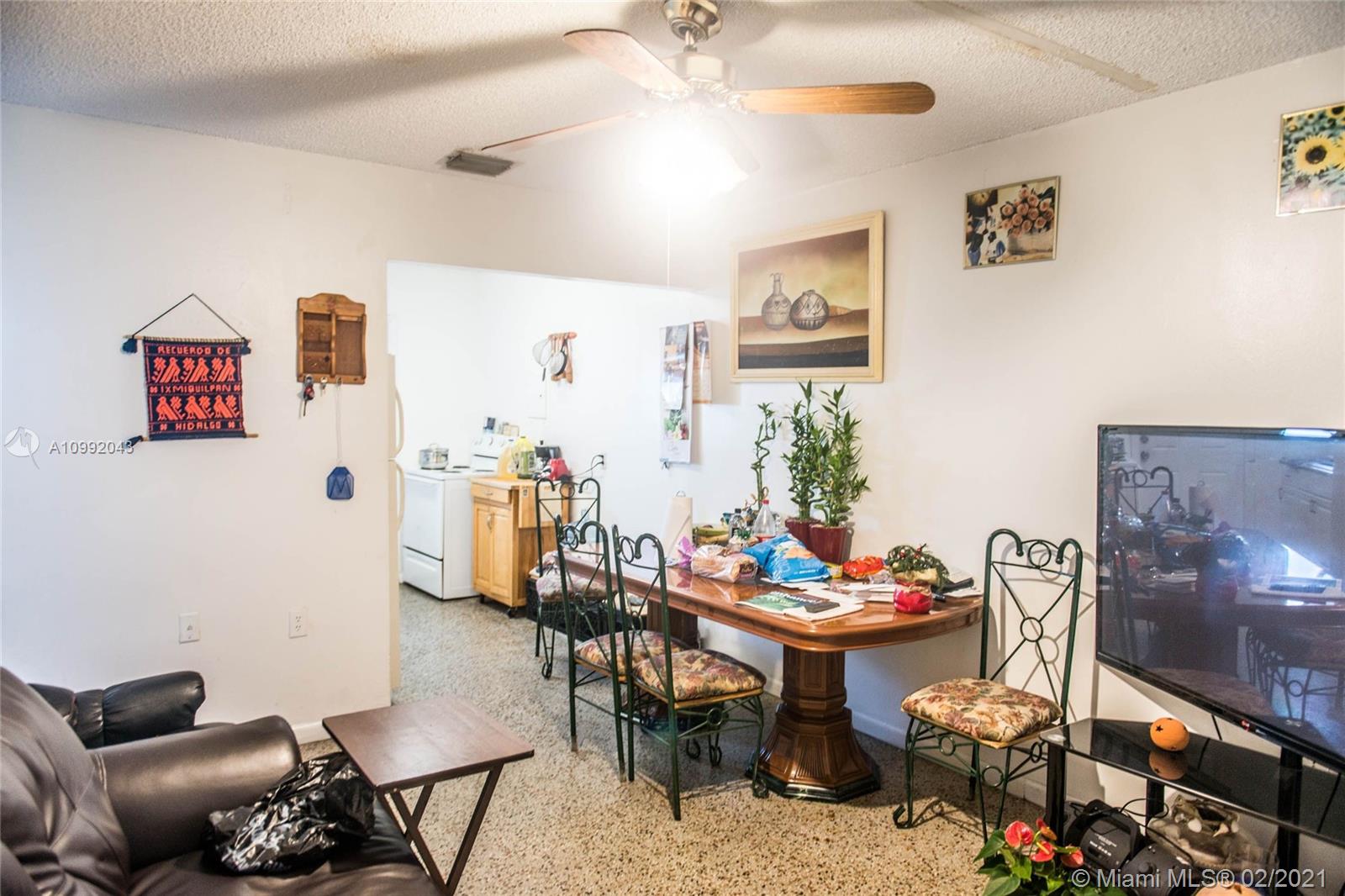 105 Northeast 2nd Road Homestead, FL 33030 - Photo 5 of 26 a outdoor room with furniture and view of kitchen