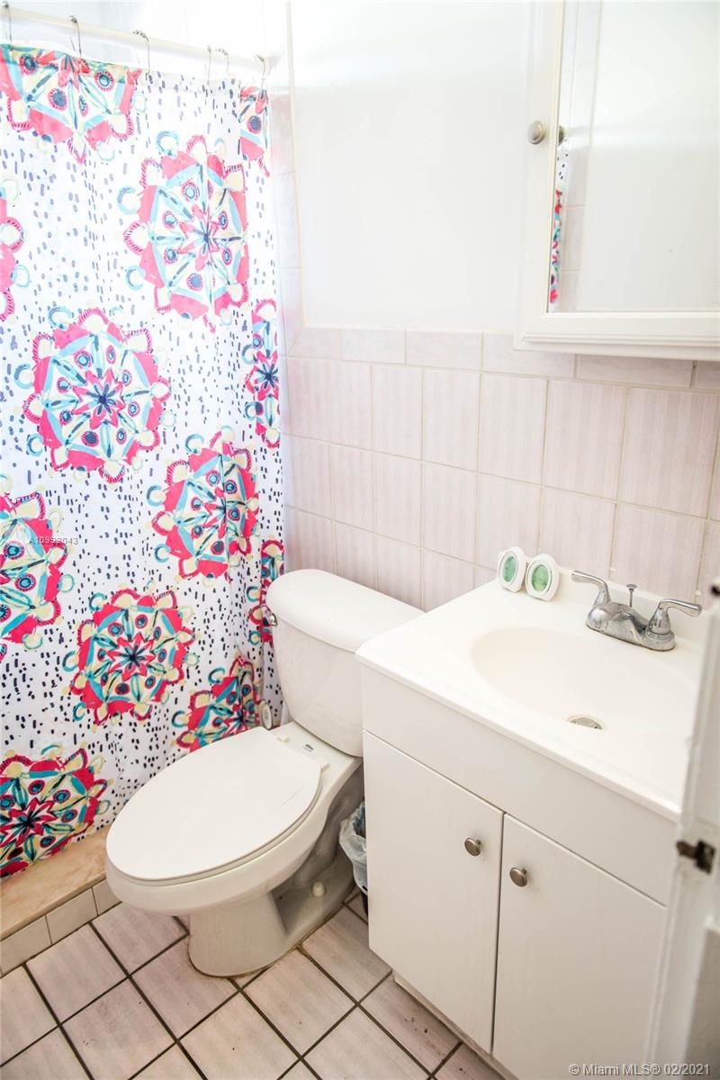 105 Northeast 2nd Road Homestead, FL 33030 - Photo 10 of 26 a bathroom with a sink toilet and shower