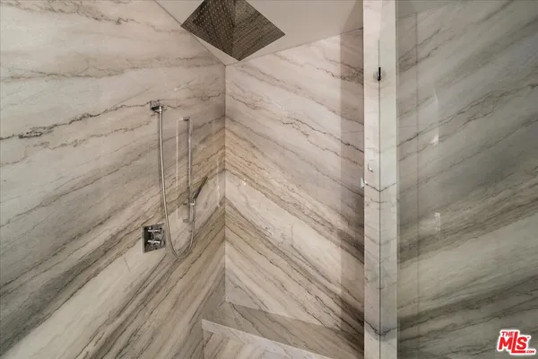 a bathroom with a bathtub a sink and a shower