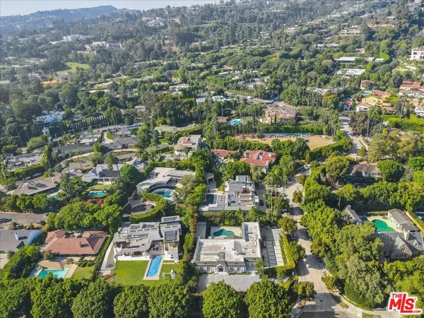 an aerial view of residential building and green space