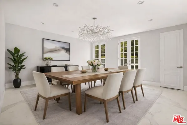 a kitchen with stainless steel appliances a sink a stove and a microwave