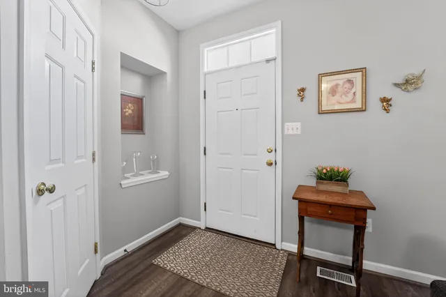 a room that has a window and a chair