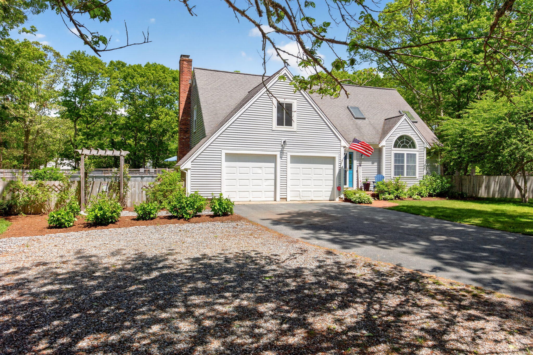 12 Sarah Lawrence Road Sandwich, MA 02563 - Photo 50 of 54 a front view of a house with a garden
