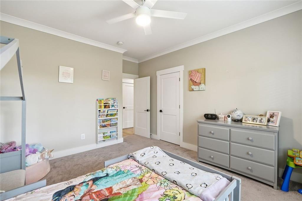 241 Bethany Manor Court Ball Ground, GA 30107 - Photo 30 of 36 a bedroom with a bed and a window