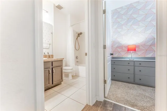 a kitchen with stainless steel appliances granite countertop a stove and a microwave