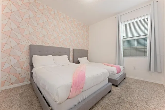 a bathroom with a granite countertop sink a toilet and a bathtub