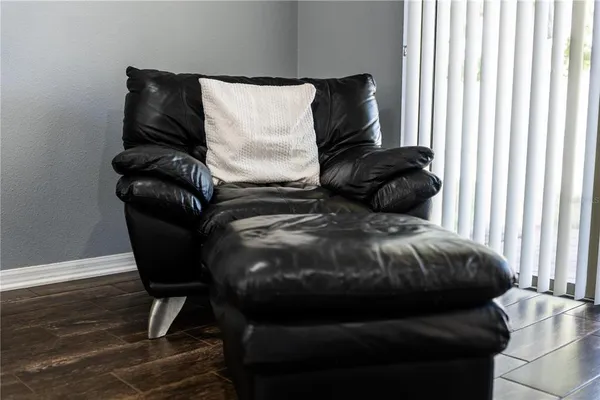 a table with a vase and flowers on it