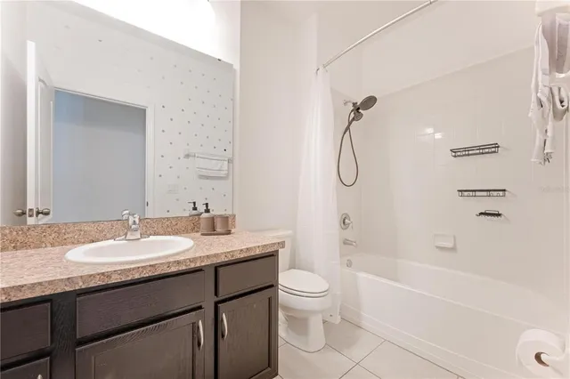 a kitchen with a sink and wooden floor