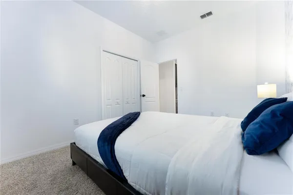 a kitchen with granite countertop stainless steel appliances and wooden cabinets