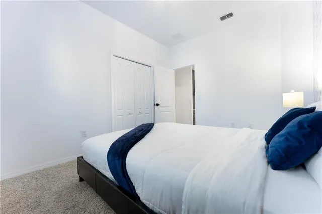 a kitchen with granite countertop stainless steel appliances and wooden cabinets