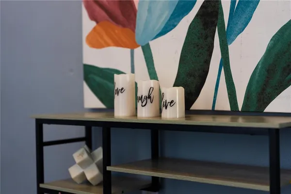 a kitchen with stainless steel appliances granite countertop a sink a stove and cabinets