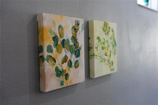 a backyard of a house with fountain table and chairs