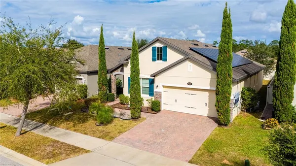 an aerial view of residential houses with outdoor space