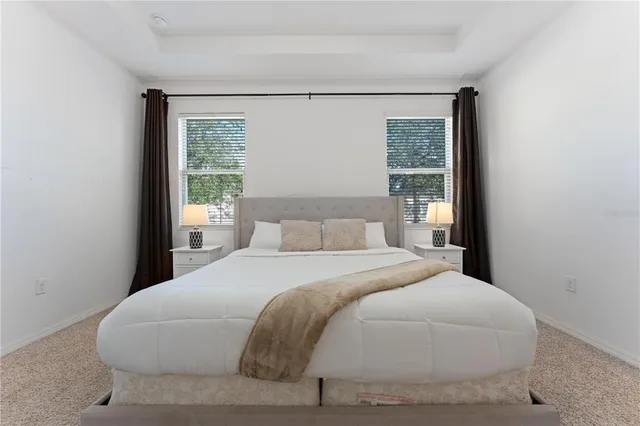 a living room with furniture a rug and a flat screen tv