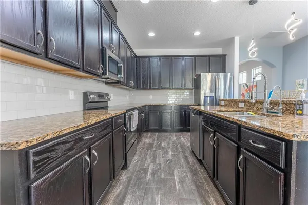a bathroom with a sink and mirror