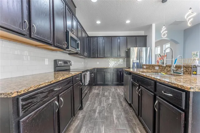 a bathroom with a sink and mirror