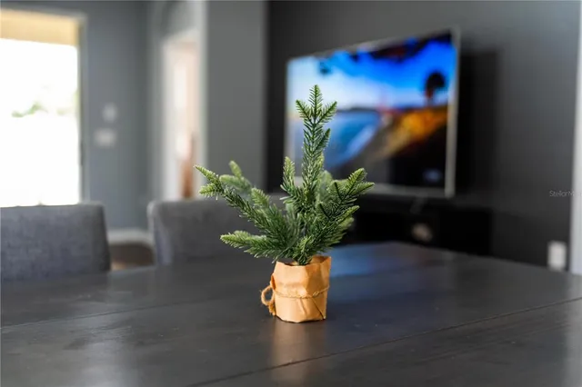 a kitchen view with granite countertop a sink and a window