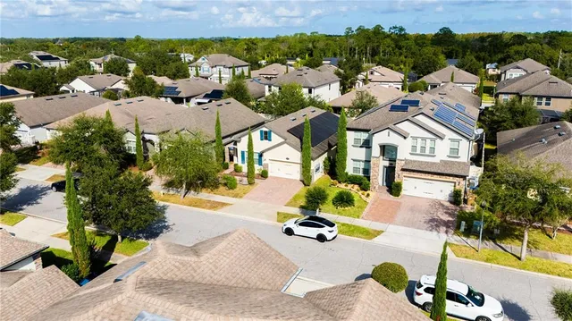 a large bed sitting in a bedroom next to a window