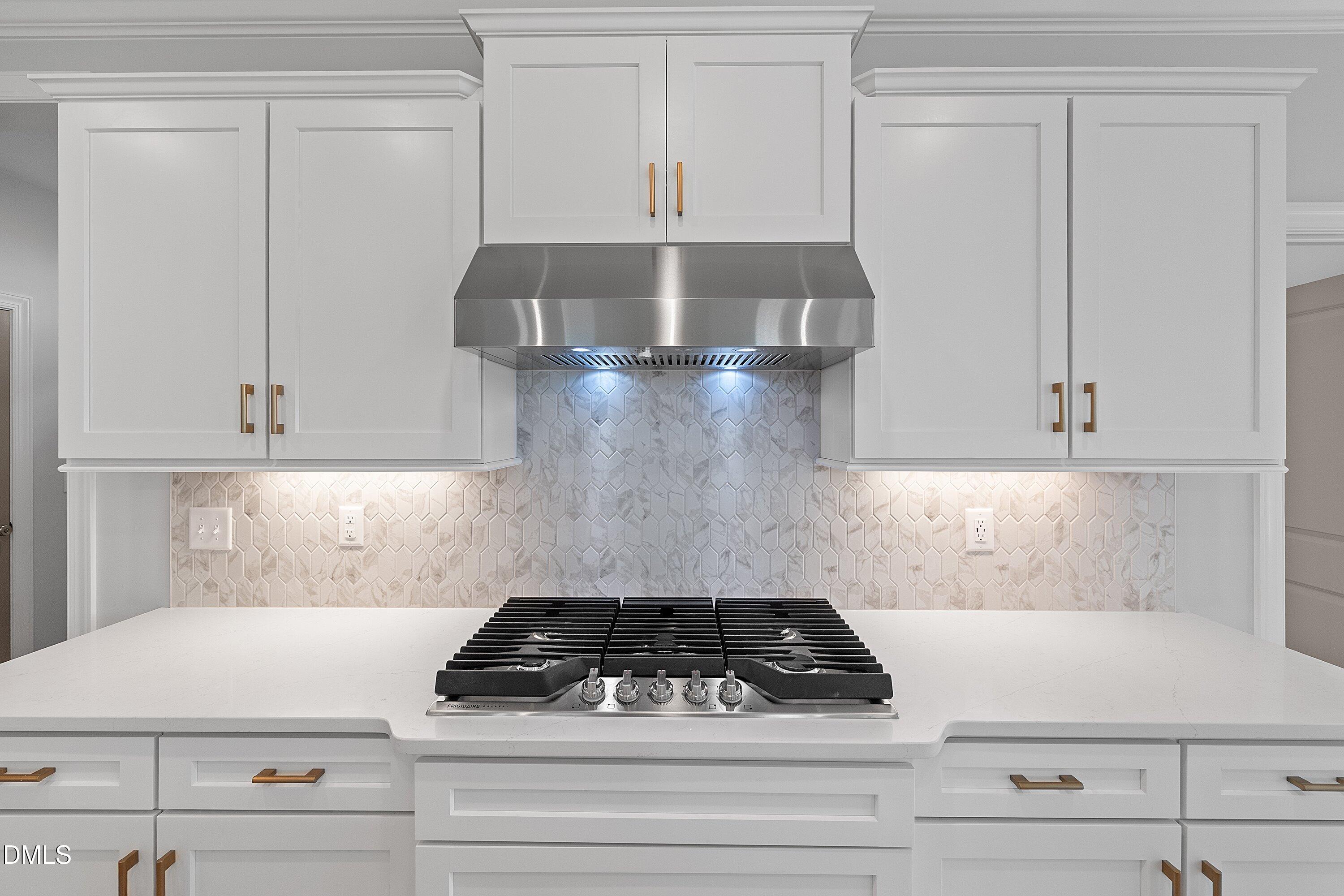 45 West Victoria Ridge Drive, Unit 32 Selma, NC 27576 - Photo 6 of 27 Cooktop and hood
