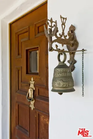 a view of a livingroom with wooden floor and a fireplace