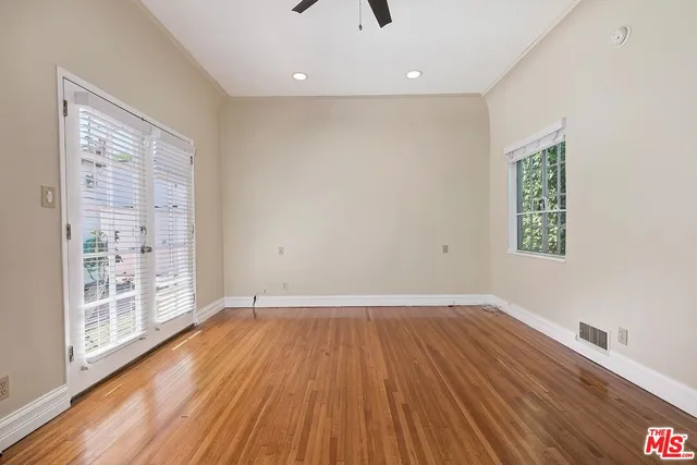 a bathroom with a shower and a glass door