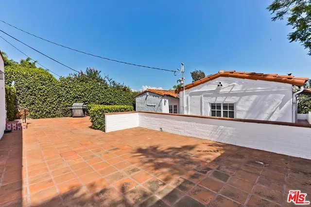 a view of a kitchen with a sink and cabinets