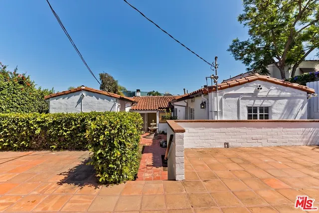 a bathroom with a sink a mirror and a bathtub